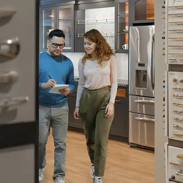young couple shopping for cabinets at lensing