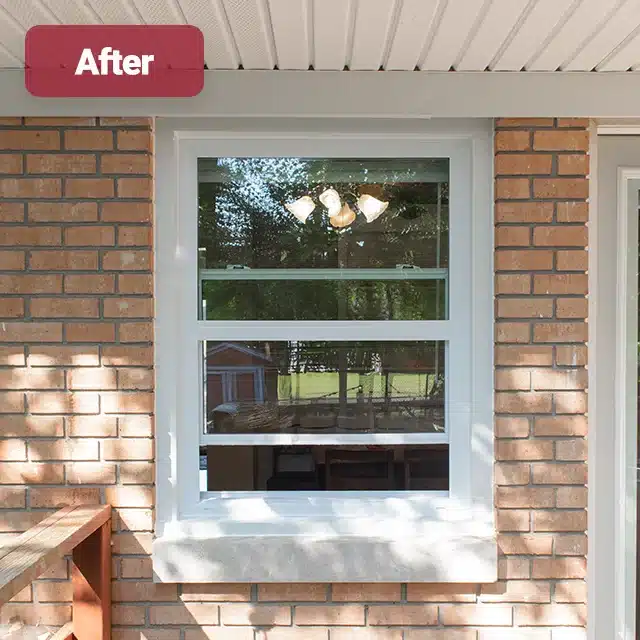 white vinyl window on brick home